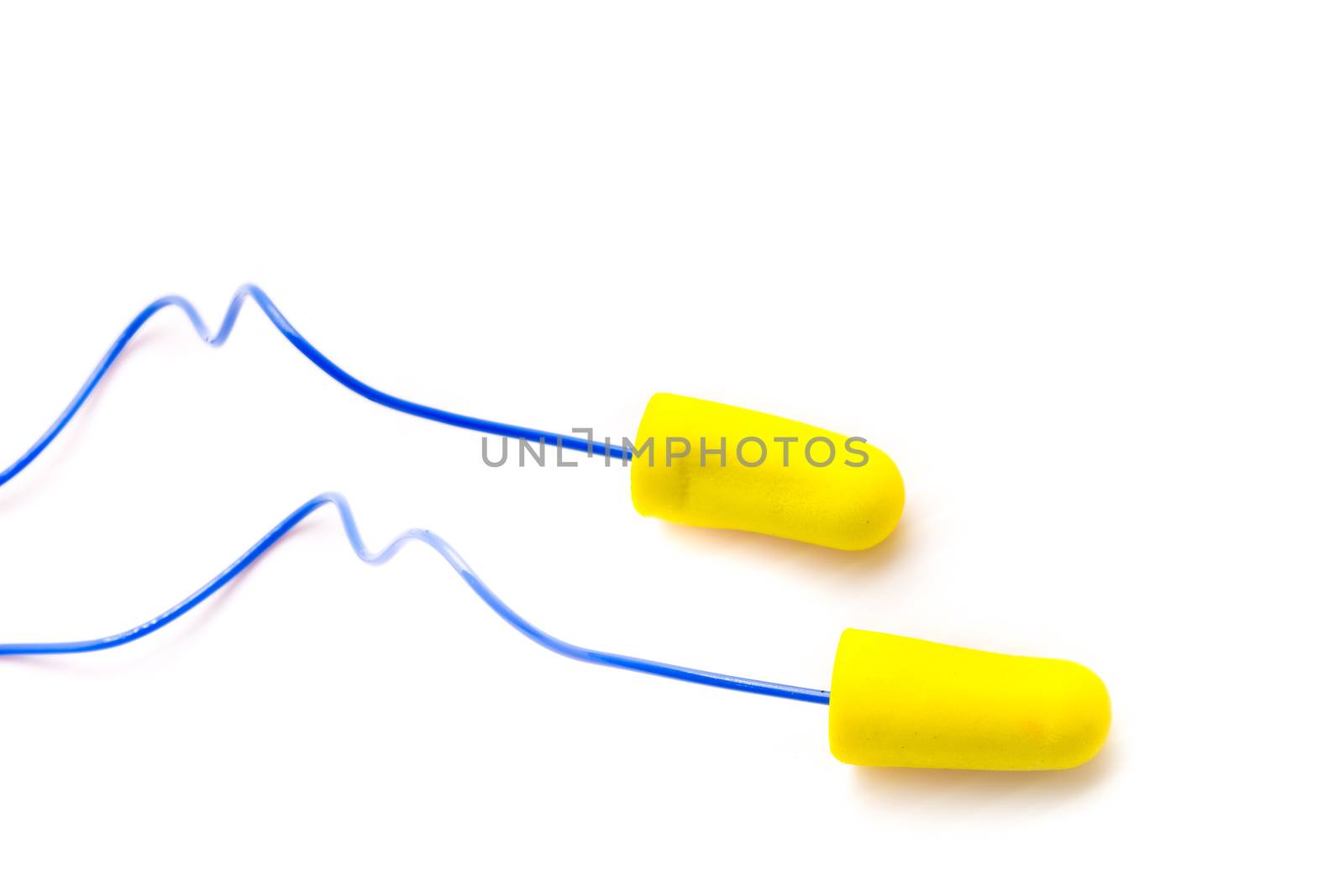 Yellow earplugs with blue band on white background.