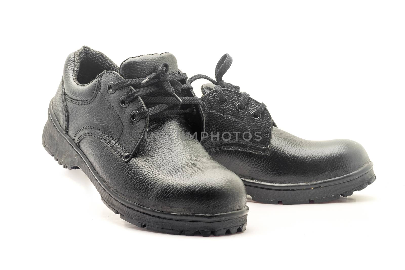 Protective workwear black safety shoes on white background.