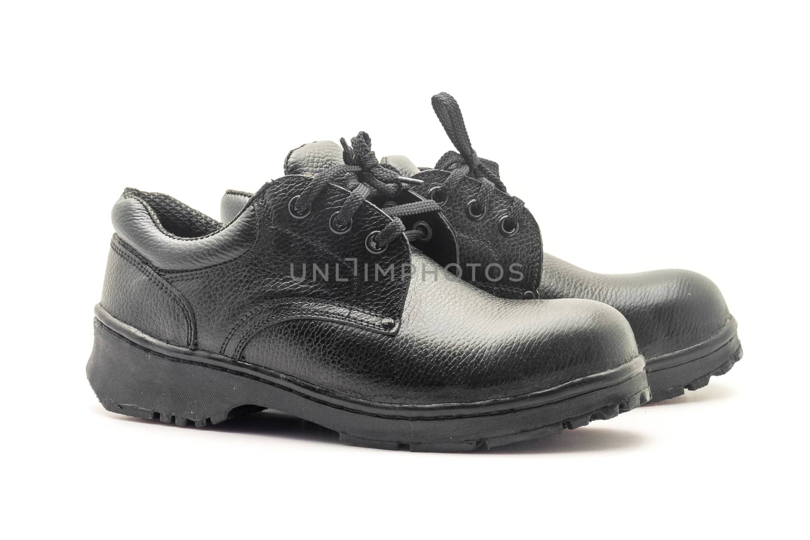 Protective workwear black safety shoes on white background.