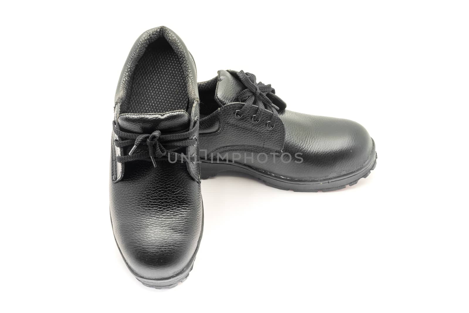 Protective workwear black safety shoes on white background.