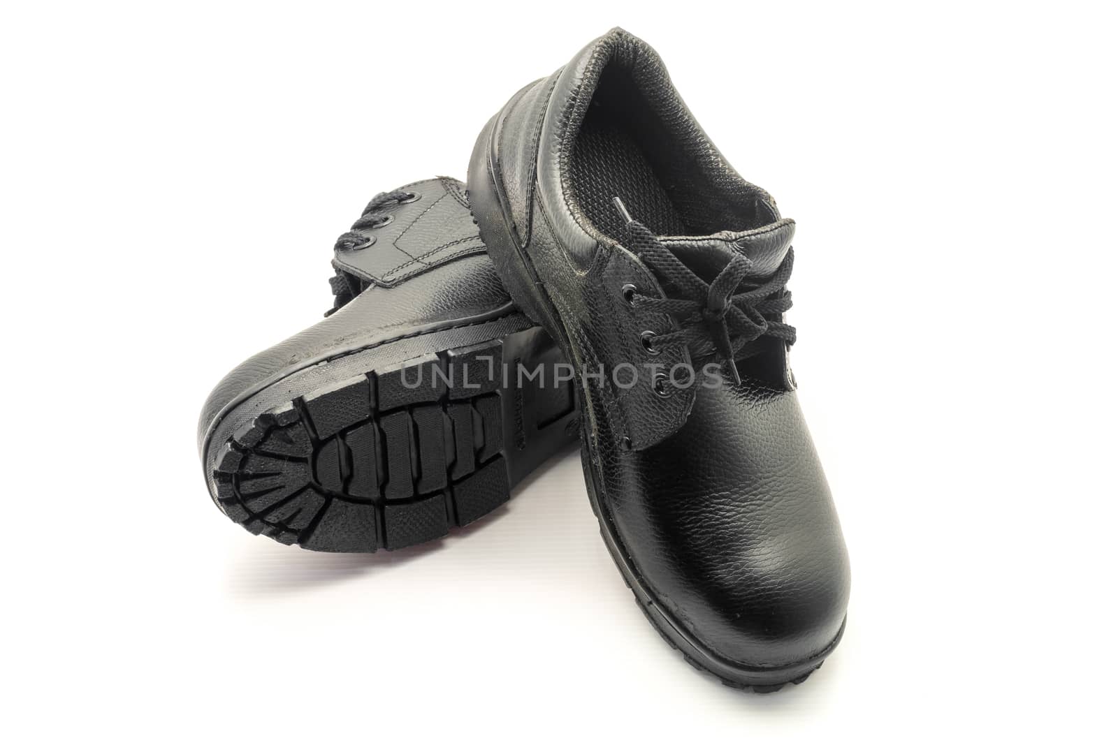 Protective workwear black safety shoes on white background.