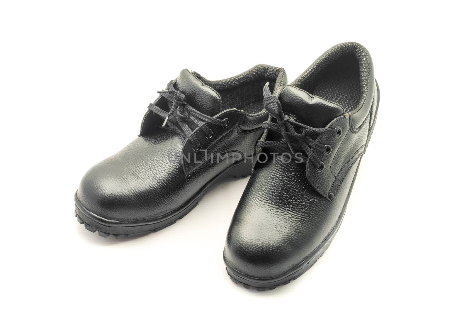 Protective workwear black safety shoes on white background.