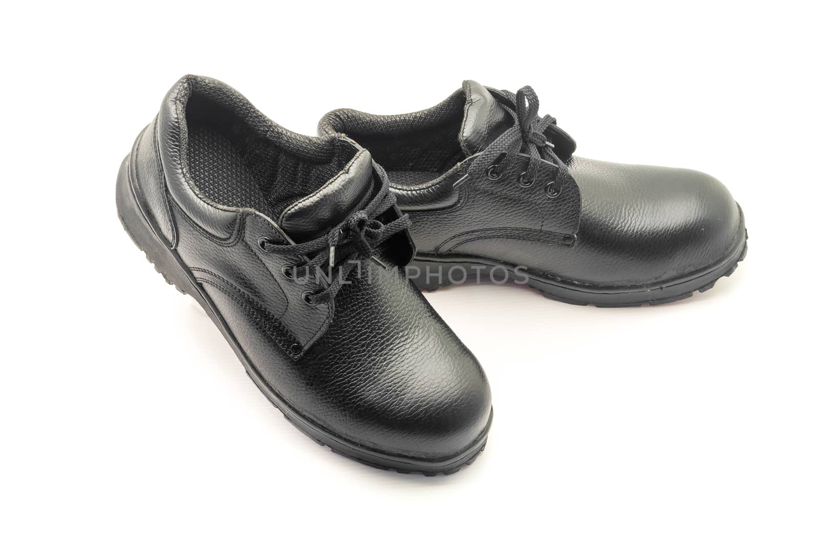 Protective workwear black safety shoes on white background.