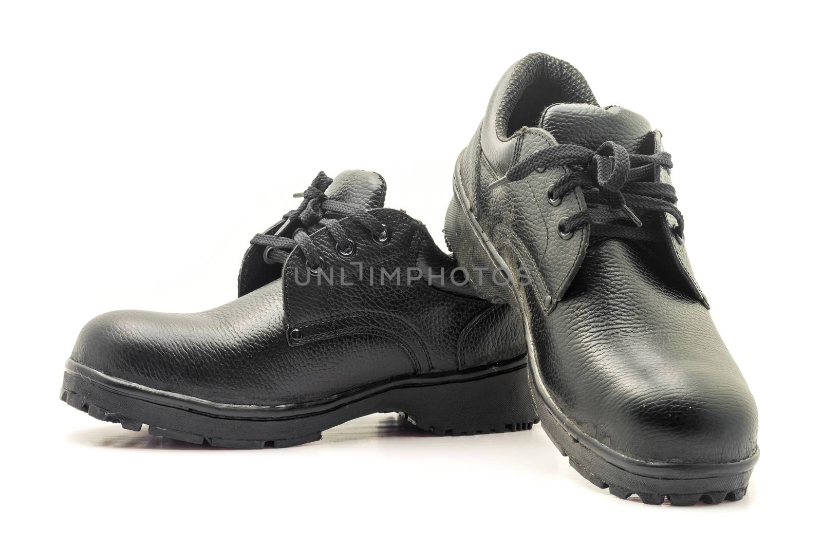 Protective workwear black safety shoes on white background.