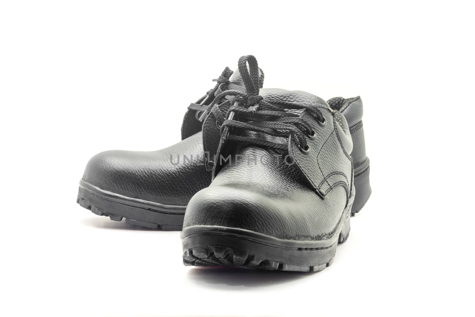 Protective workwear black safety shoes on white background.