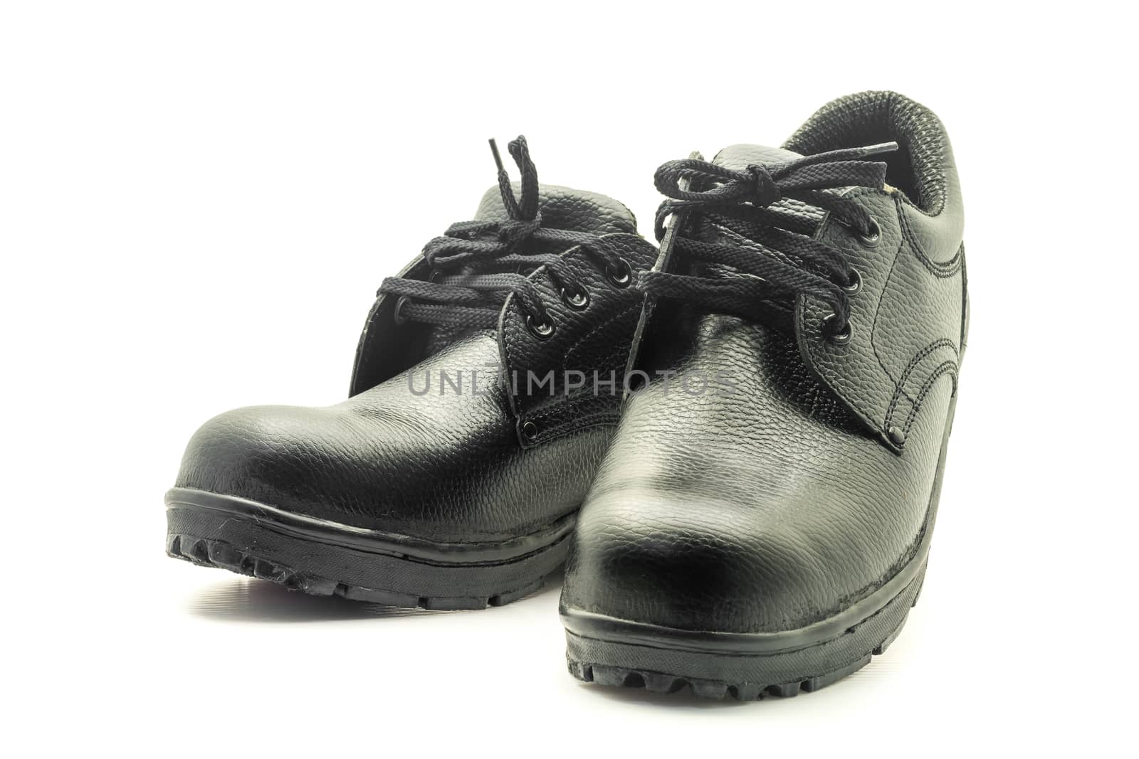 Protective workwear black safety shoes on white background.