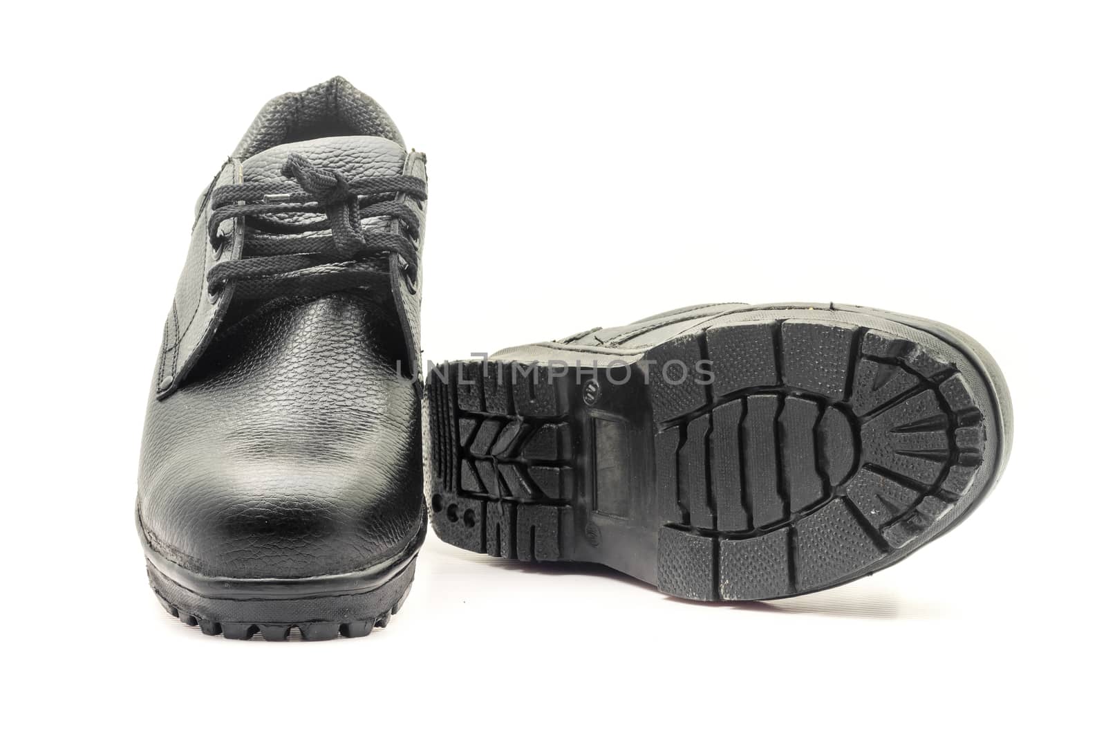 Protective workwear black safety shoes on white background.