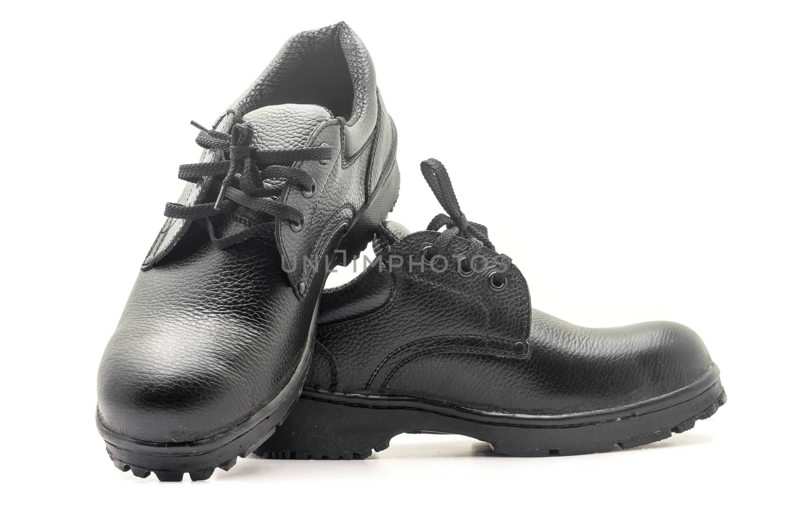 Protective workwear black safety shoes on white background.