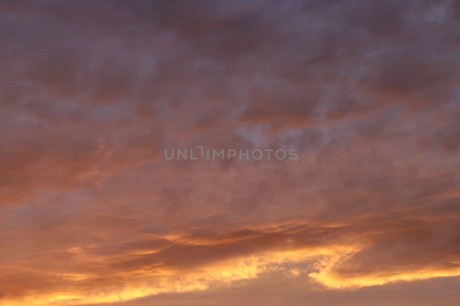 Dramatic sunset and sunrise sky. Colorful sunset with clouds in the evening