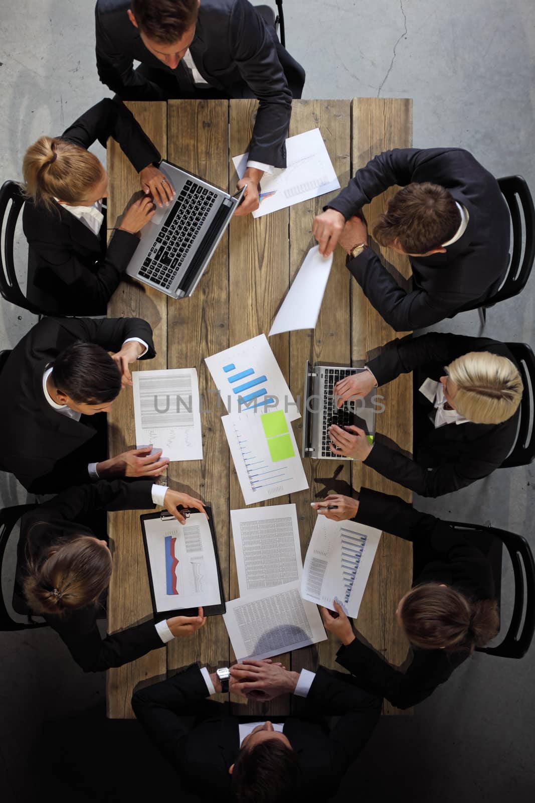 Business people analyzing documents by ALotOfPeople