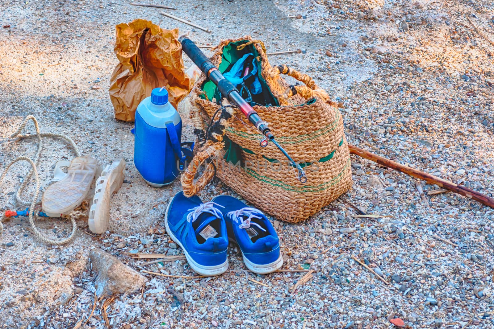 Fishing bag on the sand of the beach in HDR