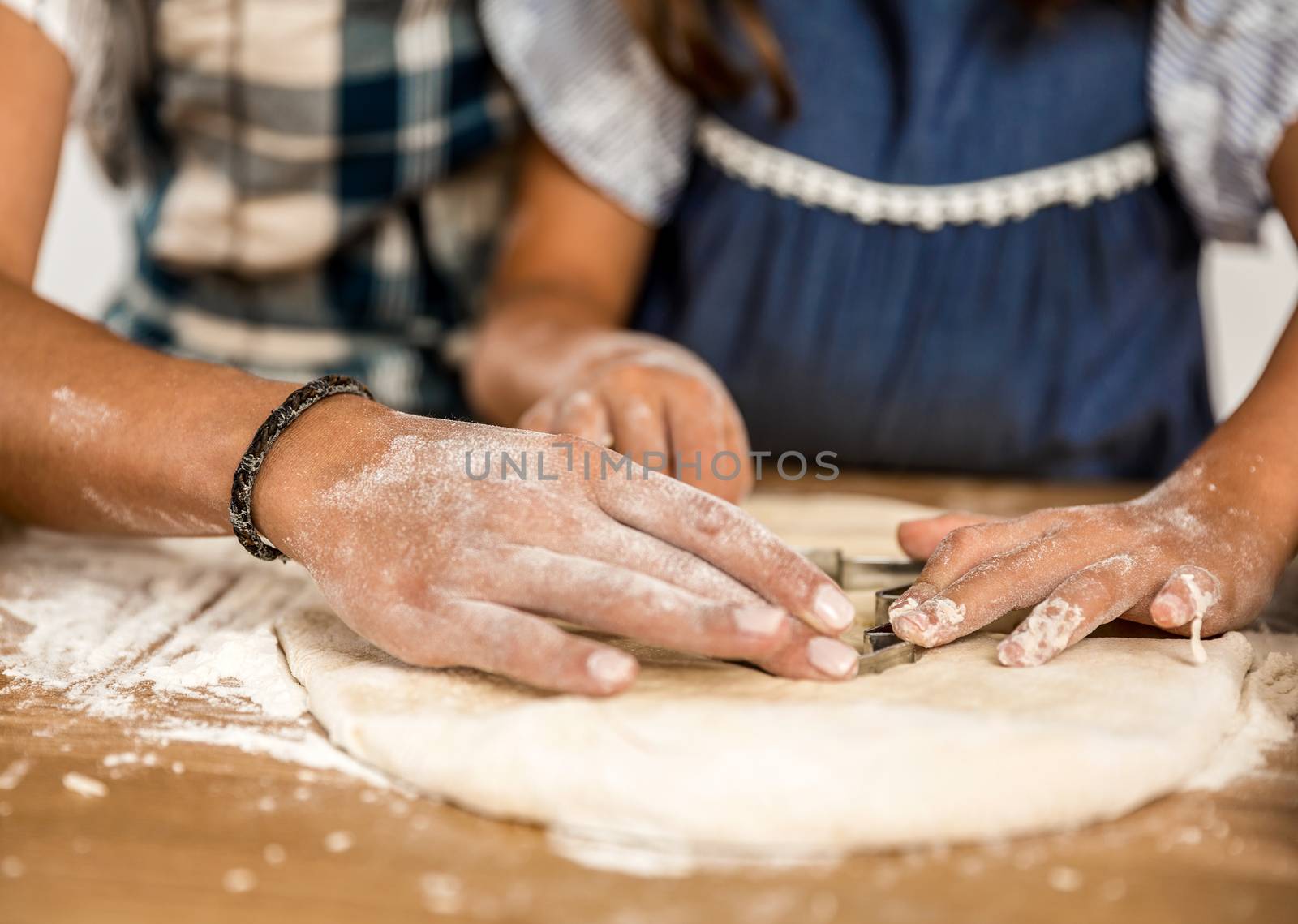 Close-up shot of hands on the paste learning to bake