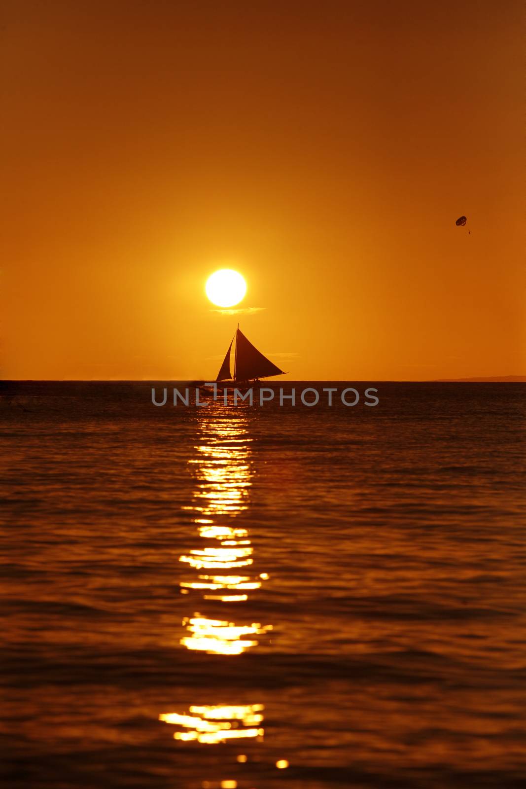 Drifting boat on a sunset. Coast of the Pacific ocean. Island Boracay