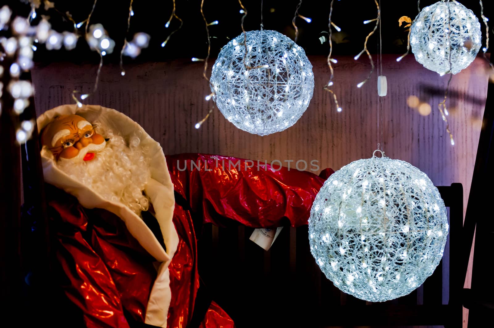 santa claus with white light balls around