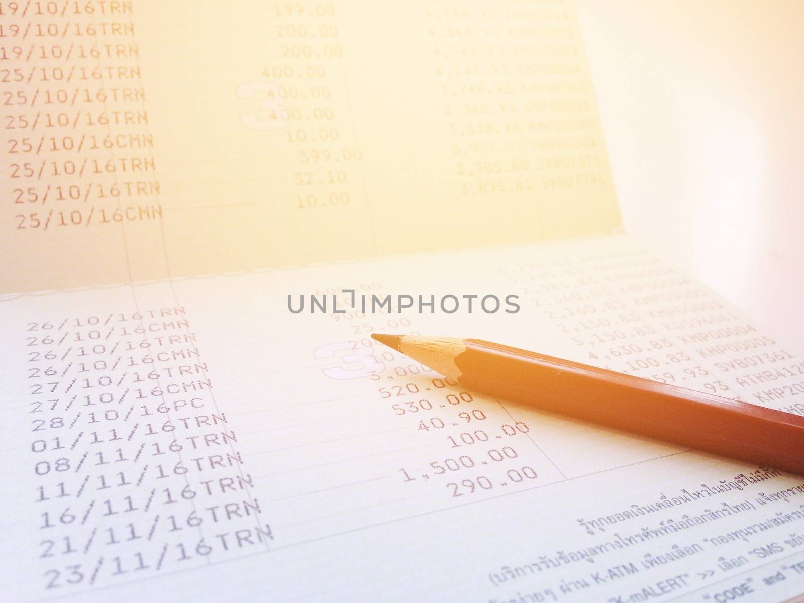 Business, finance, savings or mortgage background concept ; Pen and savings account passbook on white background