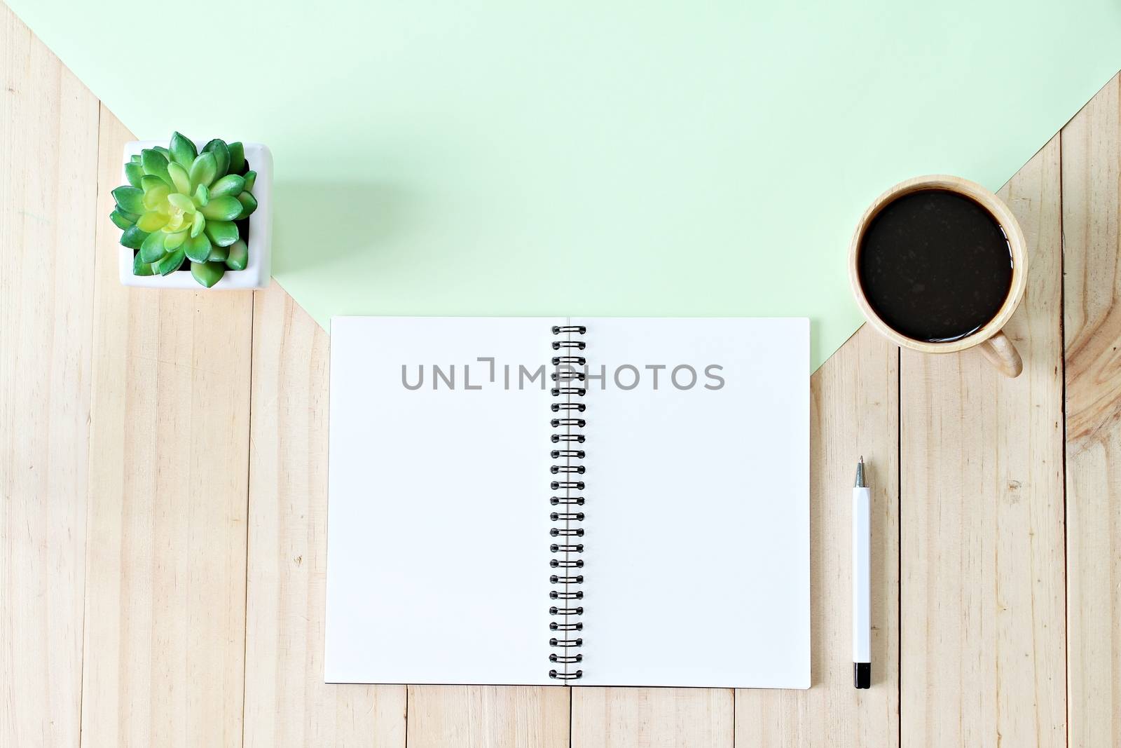 Still life, business, office supplies or education concept : Top view or flat lay of open notebook paper with blank pages and coffee cup on wooden background, ready for adding or mock up