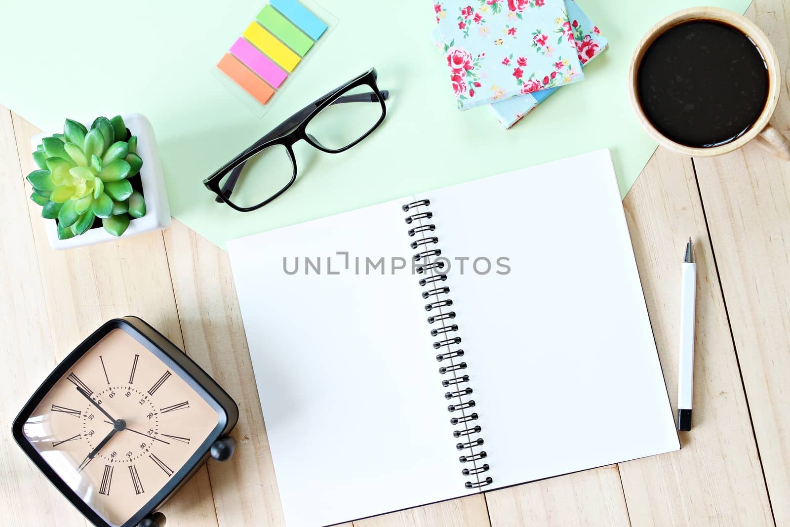 Still life, business, planning or education concept : Office desk table with open notebook paper, accessories and coffee cup, Top view or flat lay with copy space ready for adding or mock up