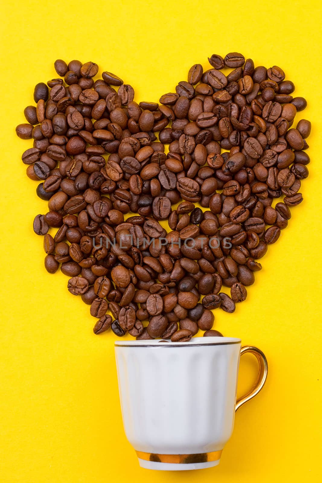A cup of coffee and heart of the beans by victosha