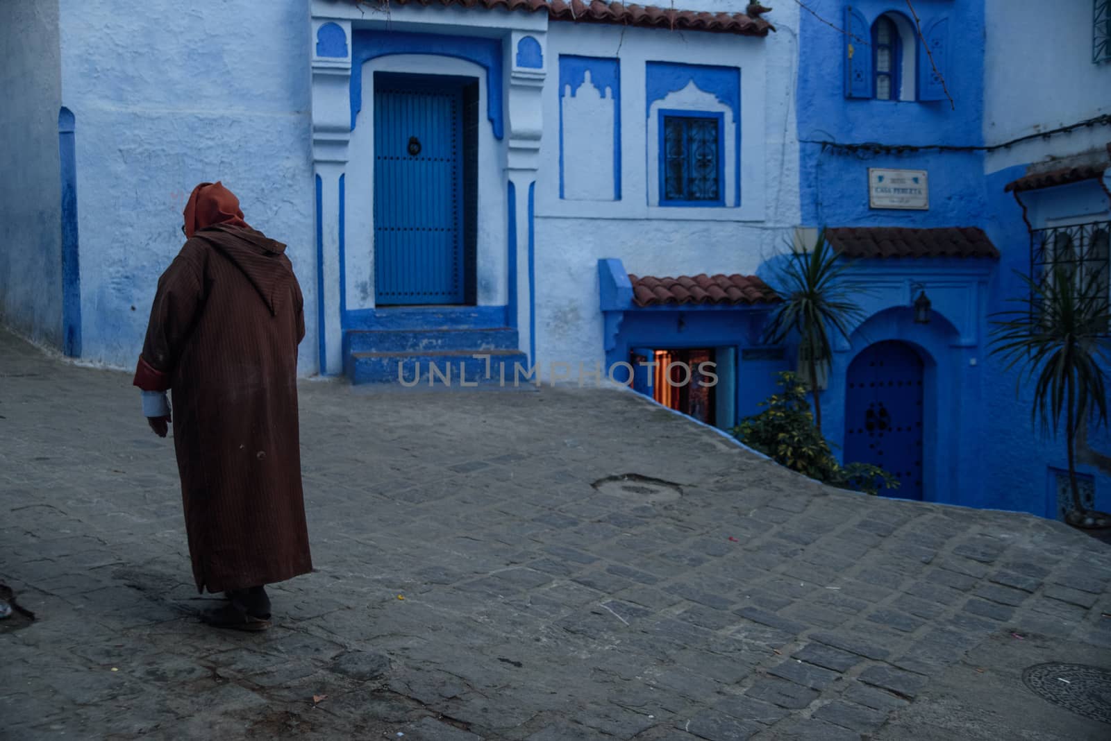 Man in Chefchaouen, the blue city in the Morocco. by johnnychaos