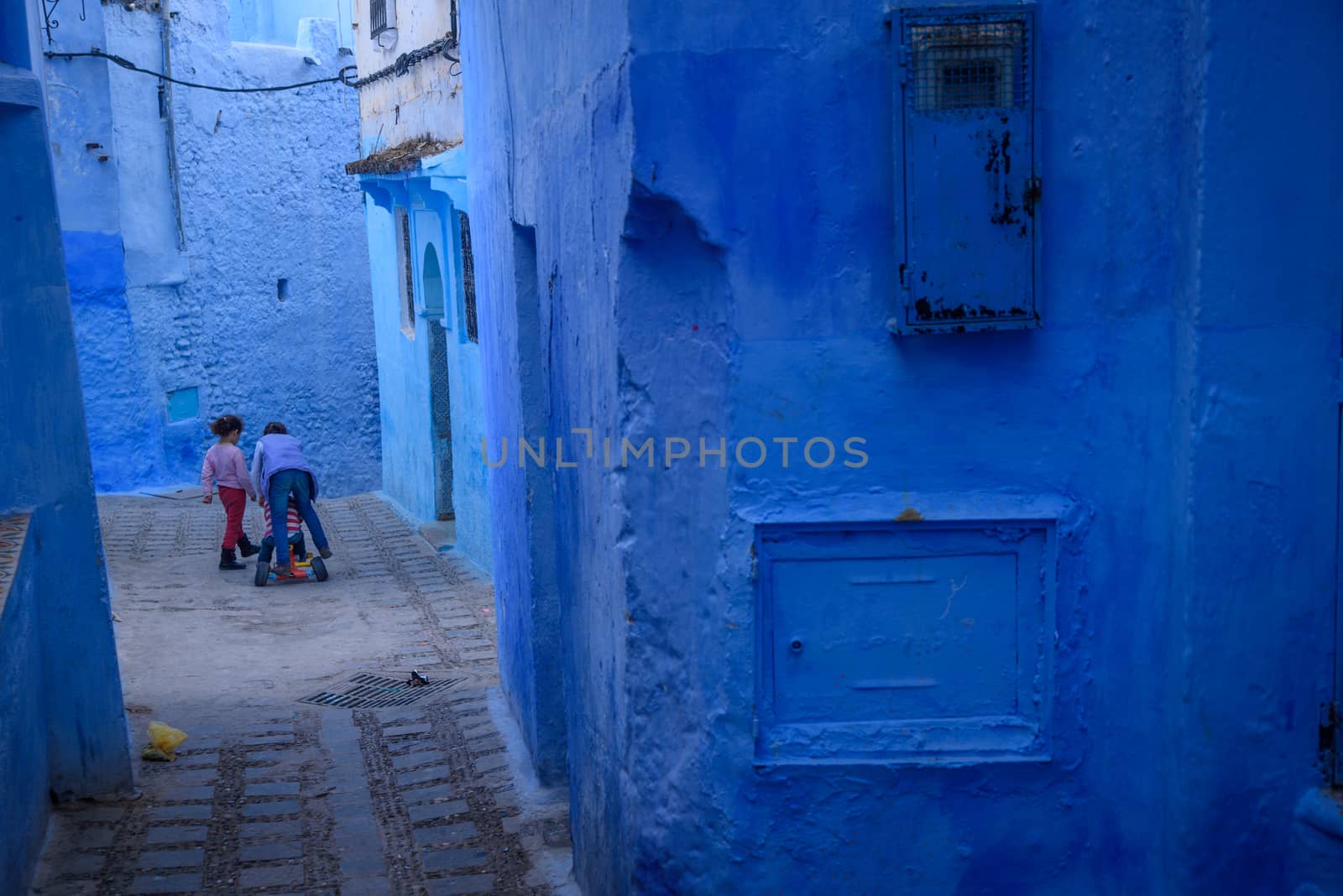 Kids in Chefchaouen, the blue city in the Morocco. by johnnychaos