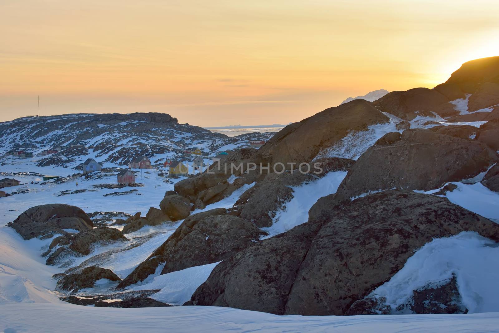Sunset over small town in  Greenland