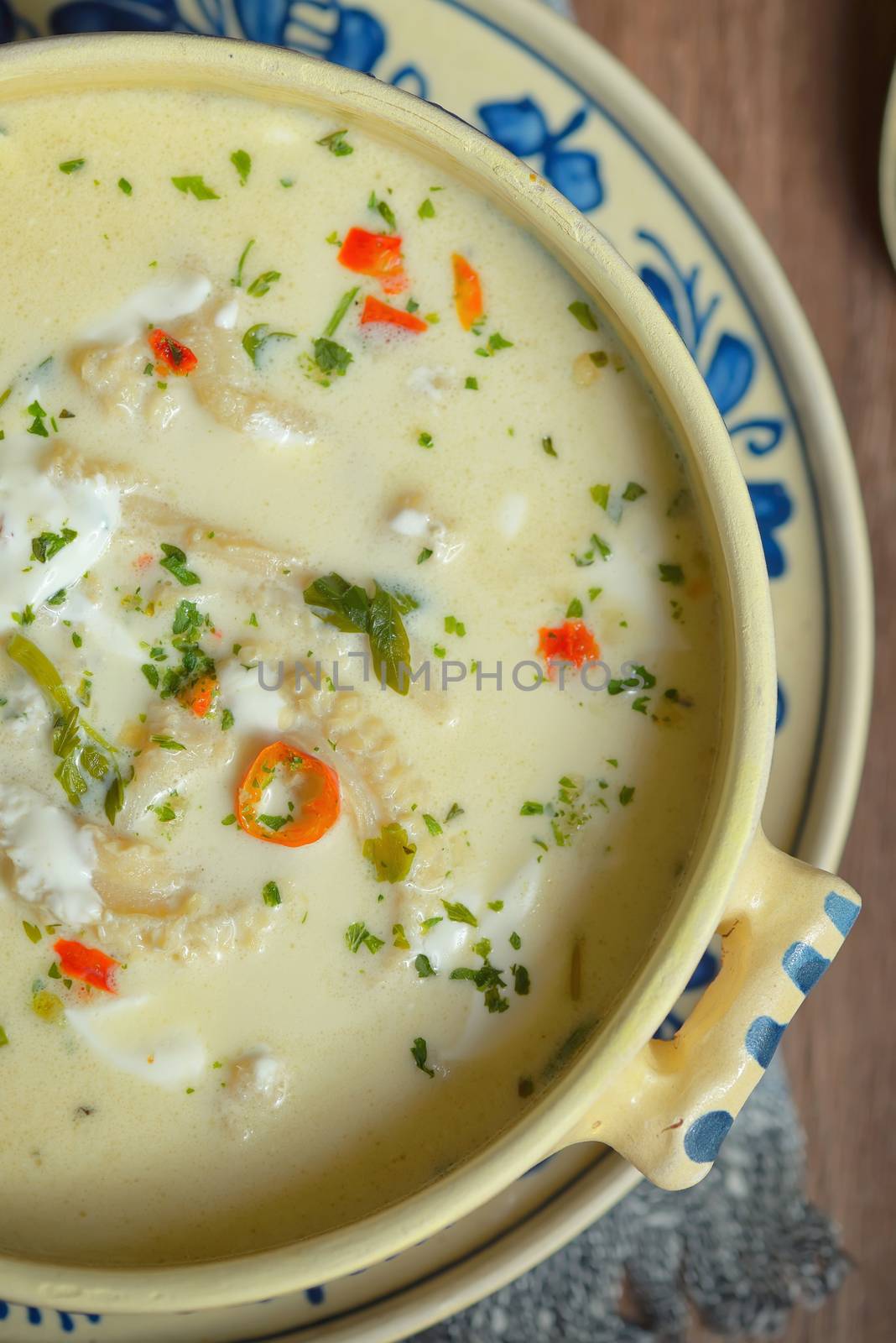Traditional tripe soup on wooden table