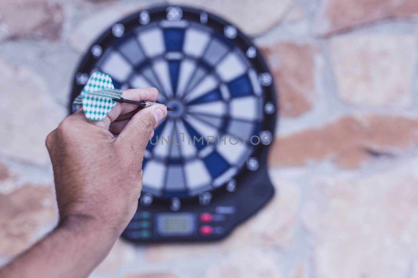 Bullseye on a wall with some darts by nachrc2001