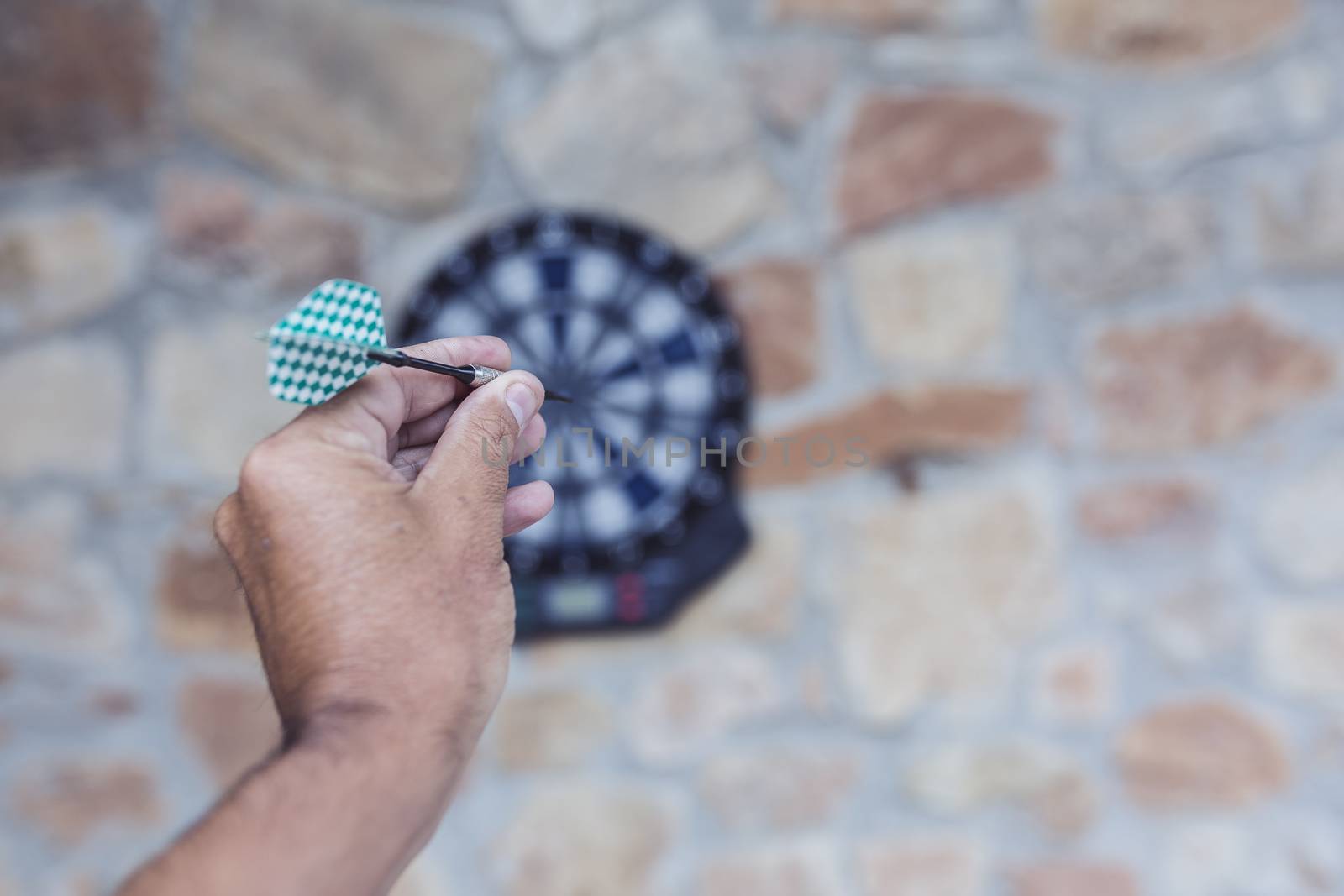 Bullseye on a wall with some darts