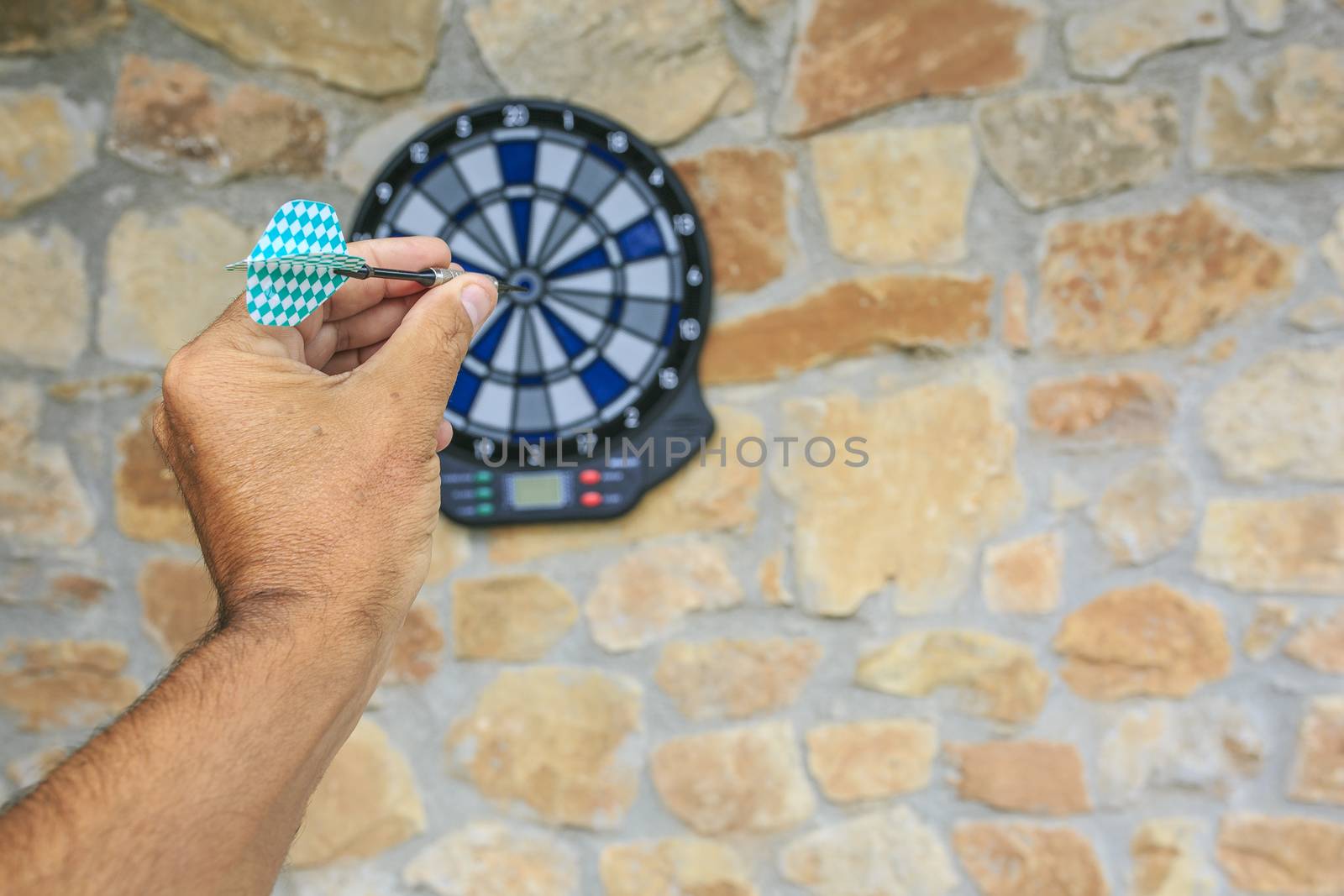 Bullseye on a wall with some darts by nachrc2001