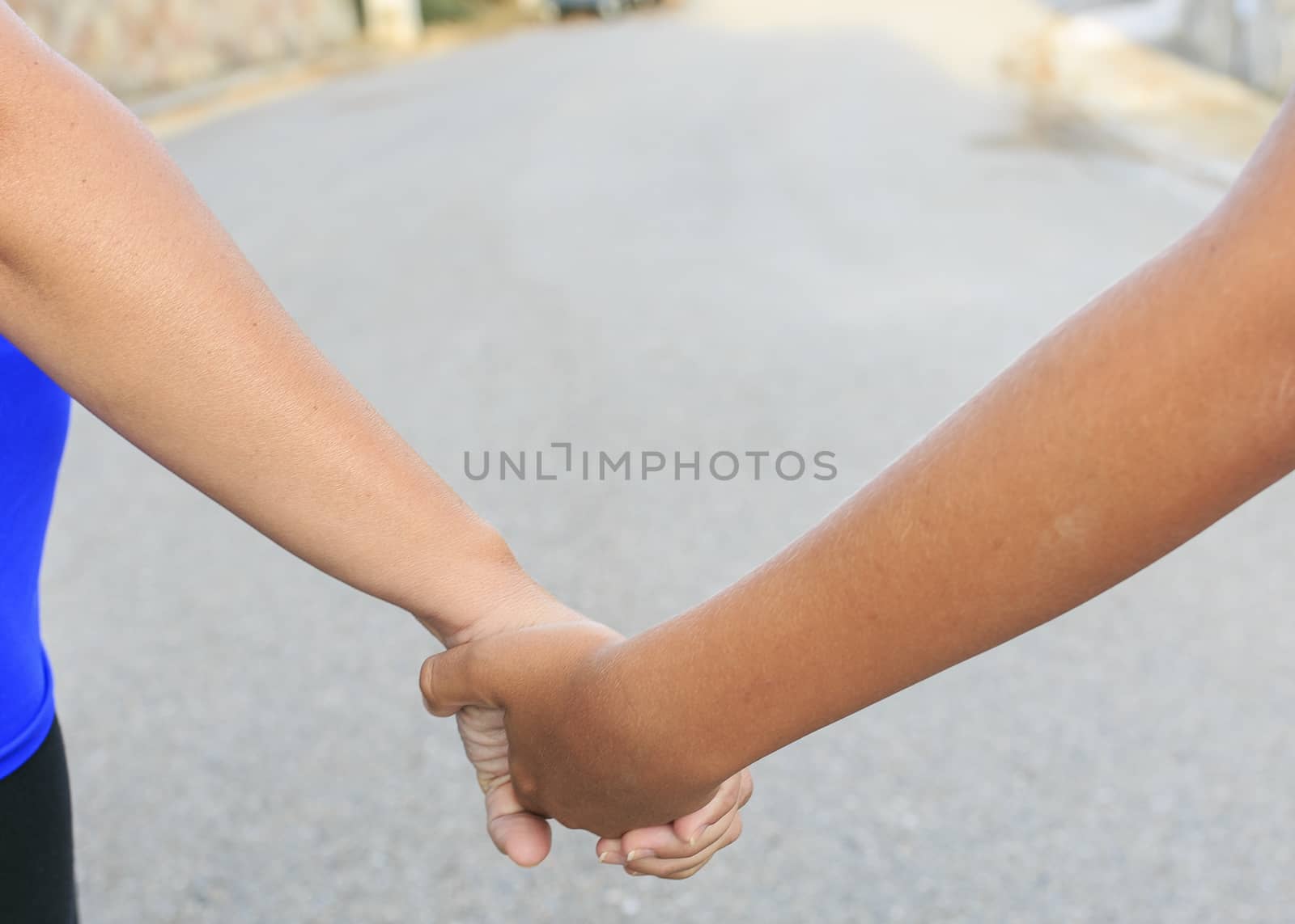 Son and mother with their hands together by nachrc2001