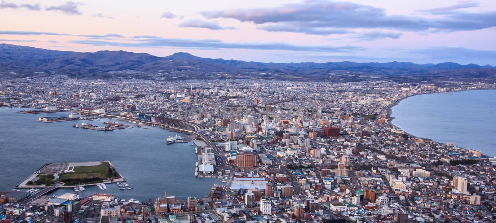 Beautiful Sunset View from Mt Hakodate, Hakodate city with bay and harbour on the peninsula with sea on both sides. Hakodate, Hokkaido, Japan. by victorflowerfly