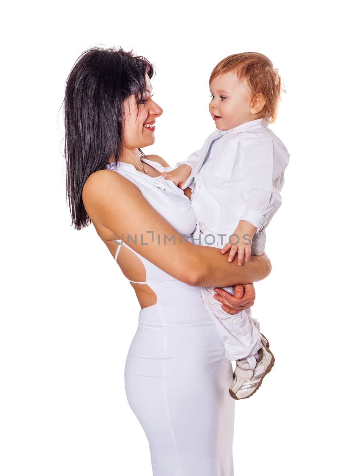 Happy Mother holding son both wearing white isolated