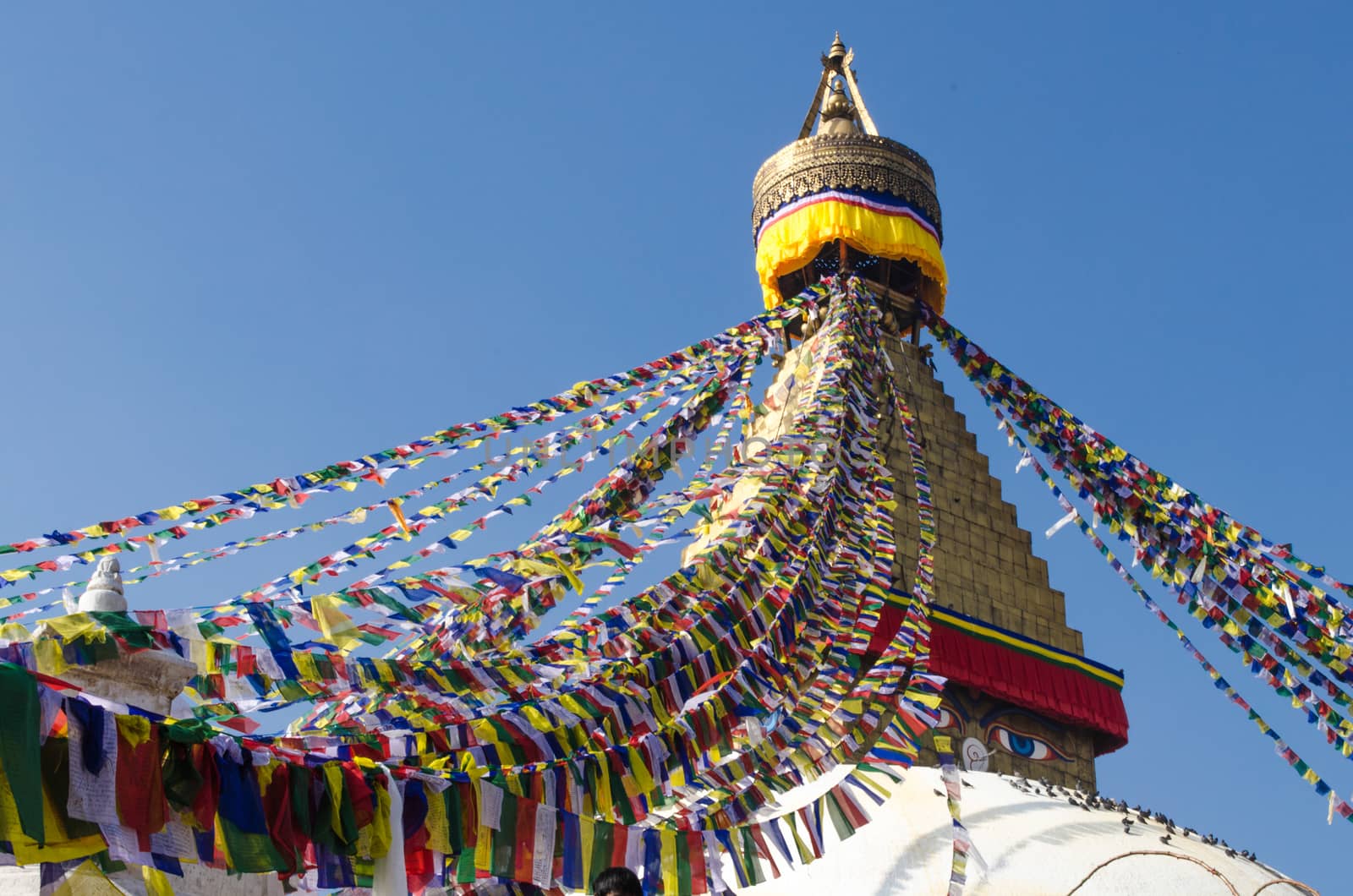 the famous buuha eye gazing out sleepily from each side of the tower are those of the all seeing primordial buddha.perched a top a hill on the western edge of the kathmandu valley.