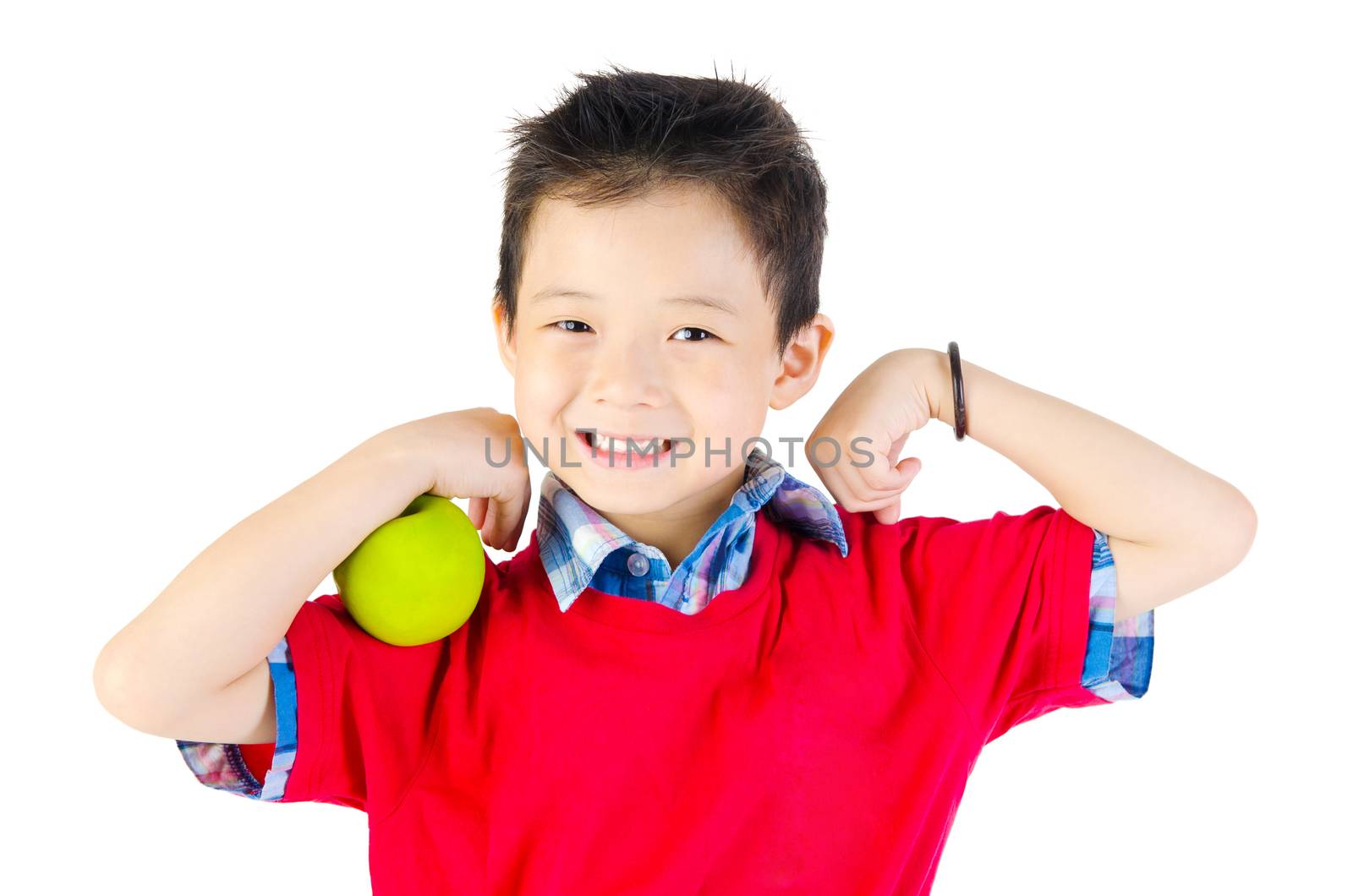 A little boy flexes his muscle while showing off the apple that made him strong and healthy