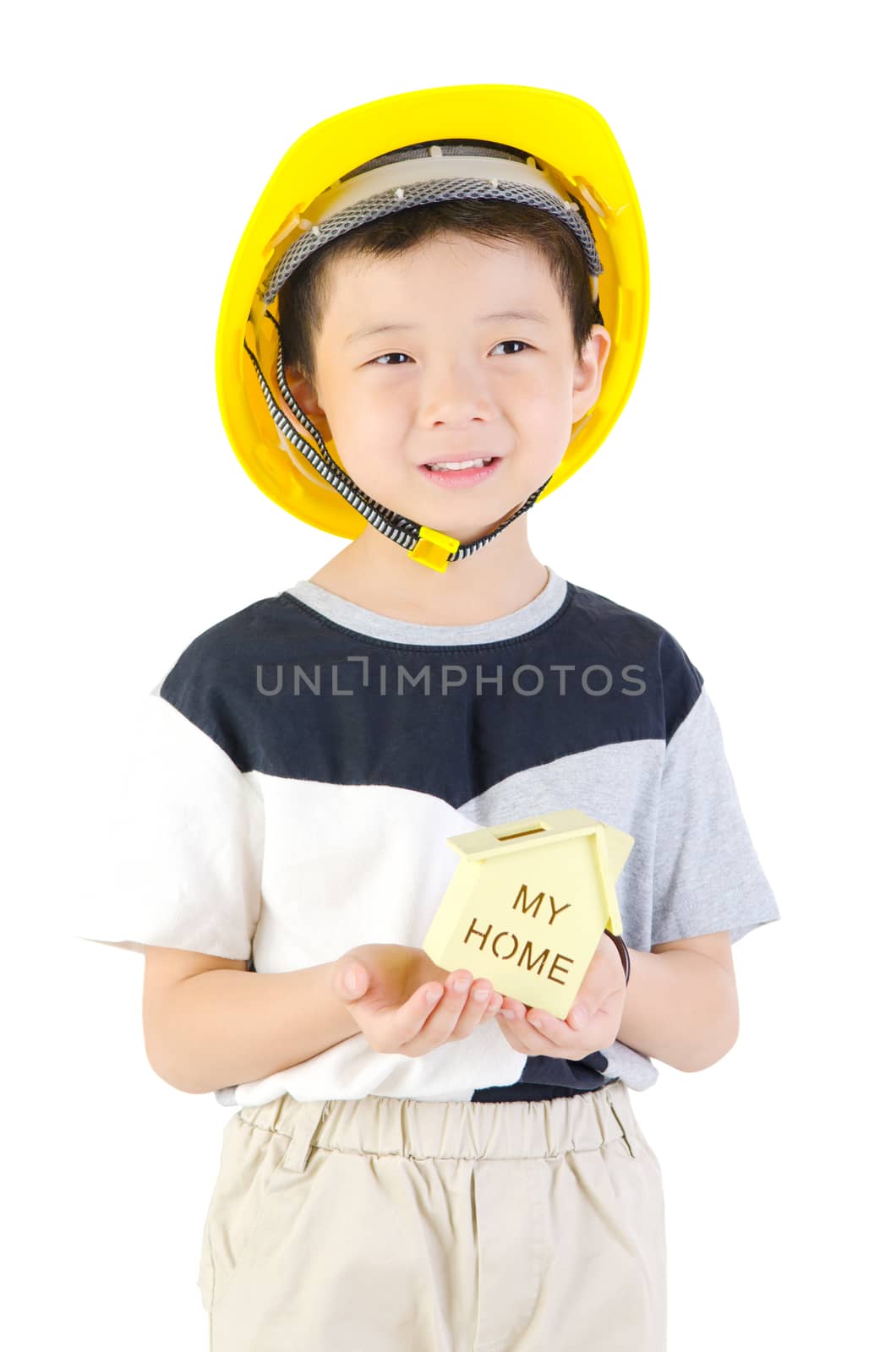 Close-up of architect boy holding model home on white background