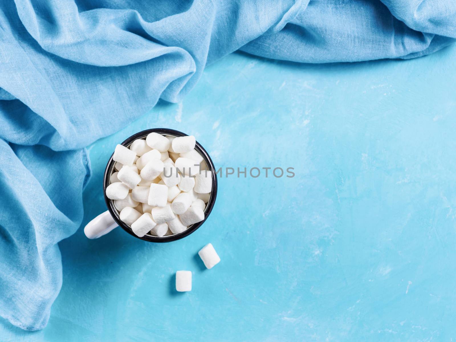 Marshmallows on blue background with copyspace by fascinadora