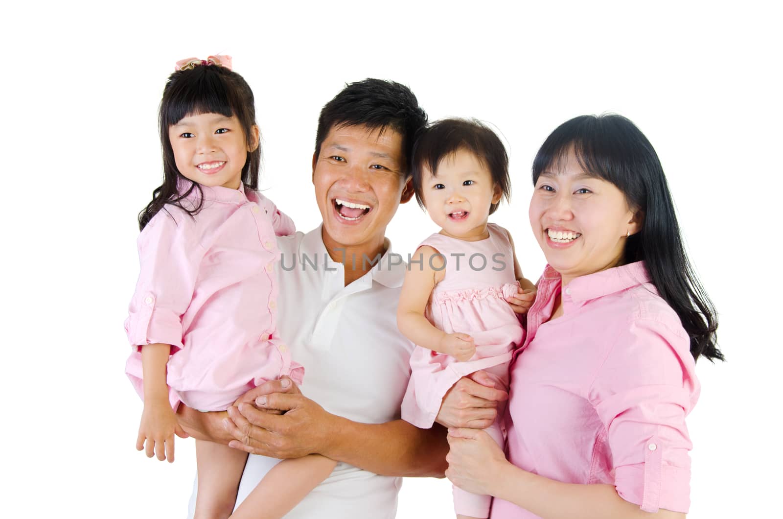 Portrait of a happy asian family in the studio