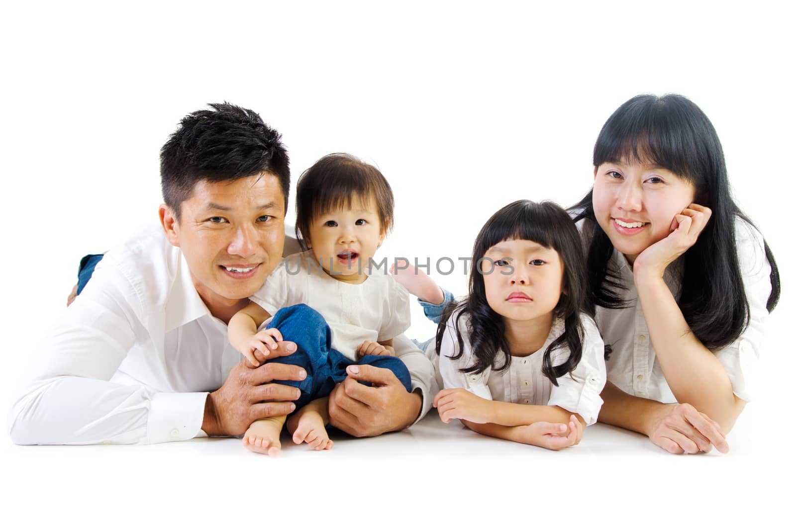 Indoor portrait of asian family in the studio