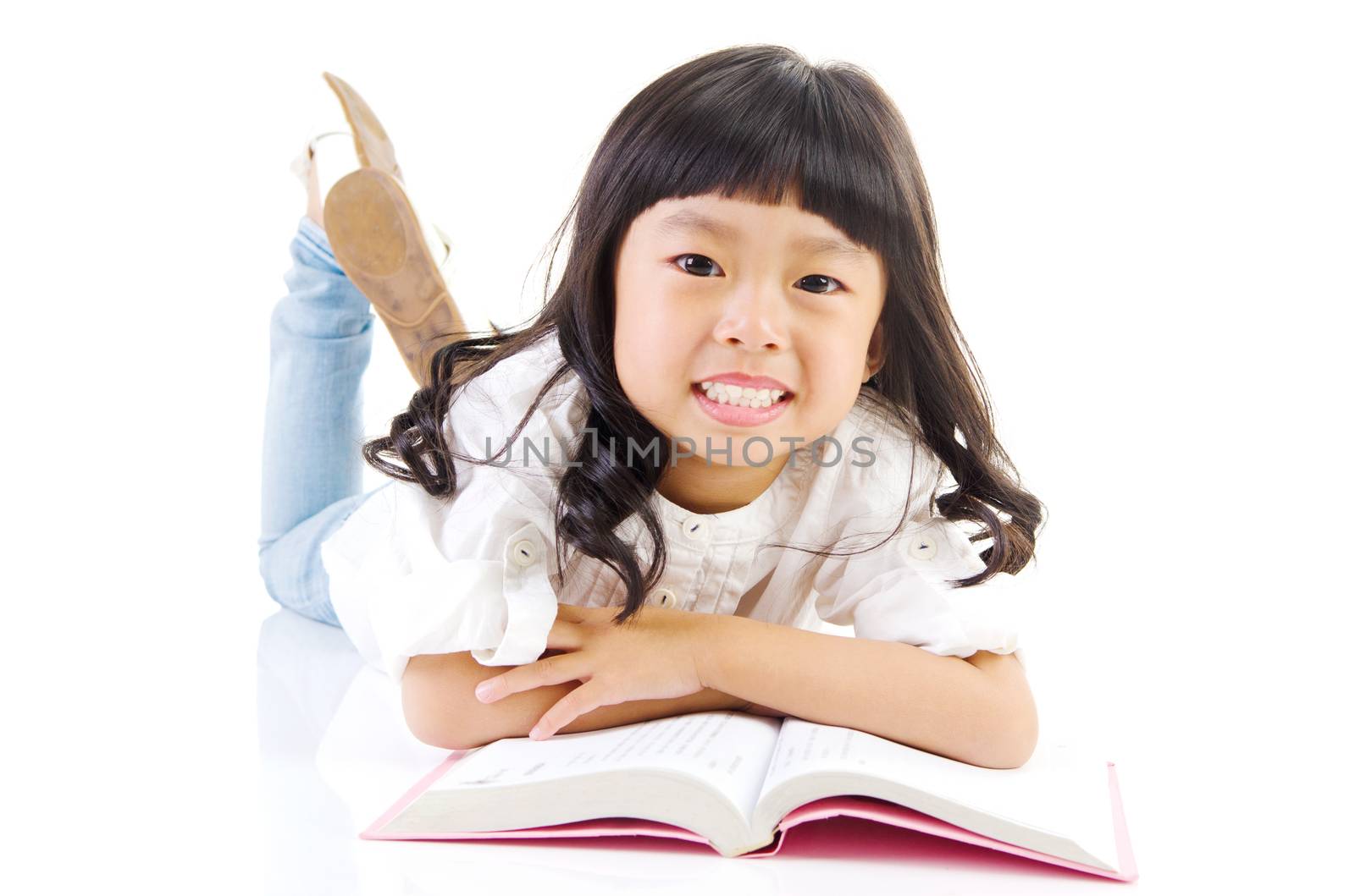 Asian girl lying on the floor and reading