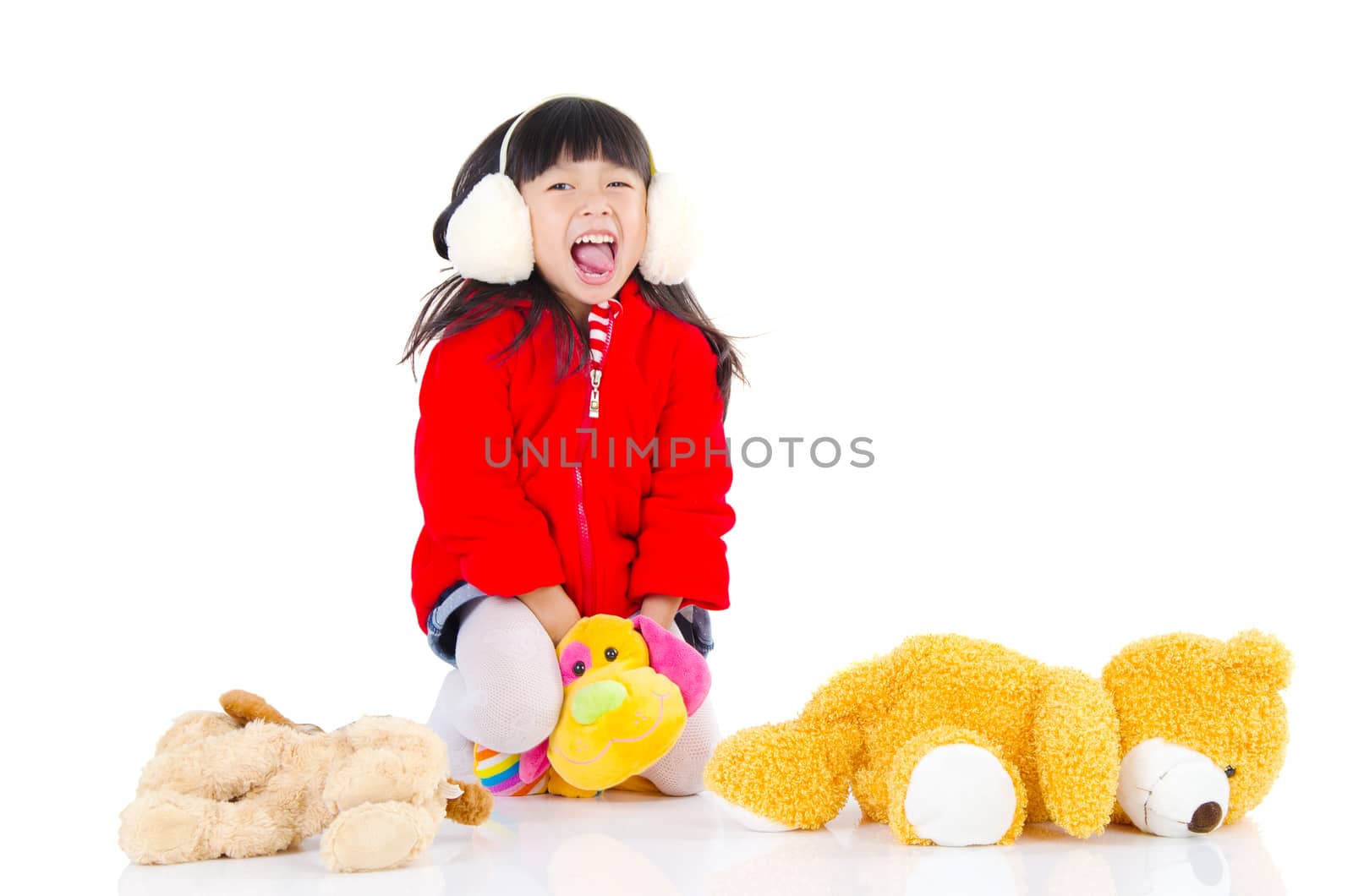 Portrait of a lovely asian girl playing on the studio