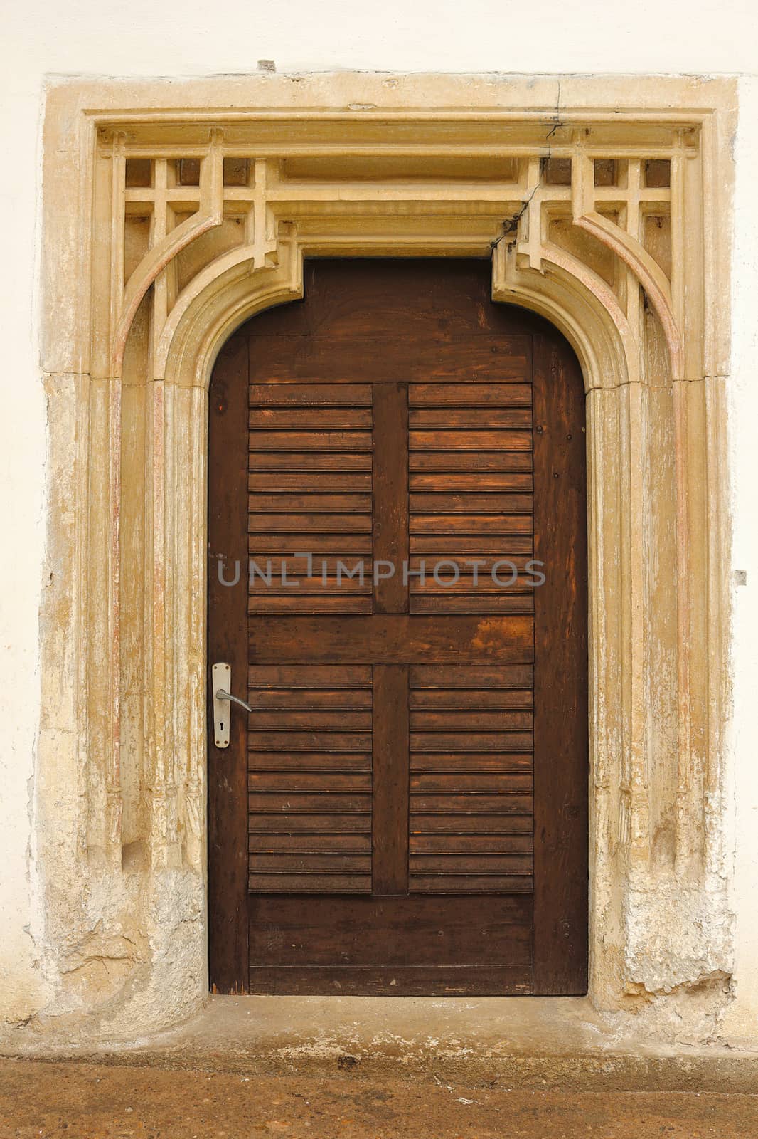 detailed entrance of old church with sculpted stone surround