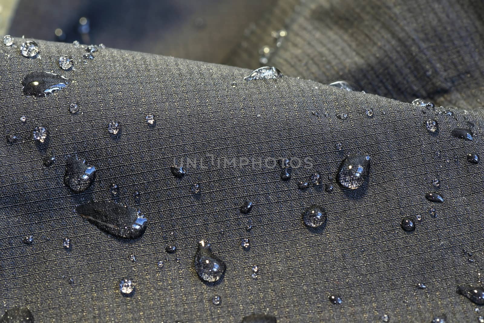 detail of fabric water repellent by taviphoto