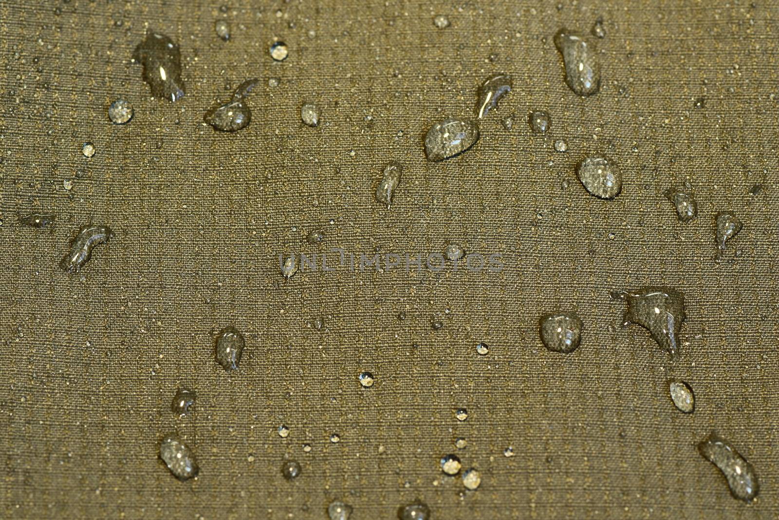 detail of water repellent green material with drops