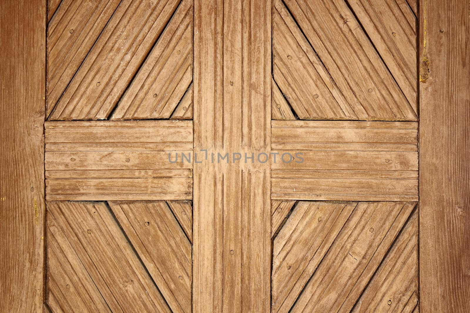 detail on old romanian wooden door, handmade ancient wood texture