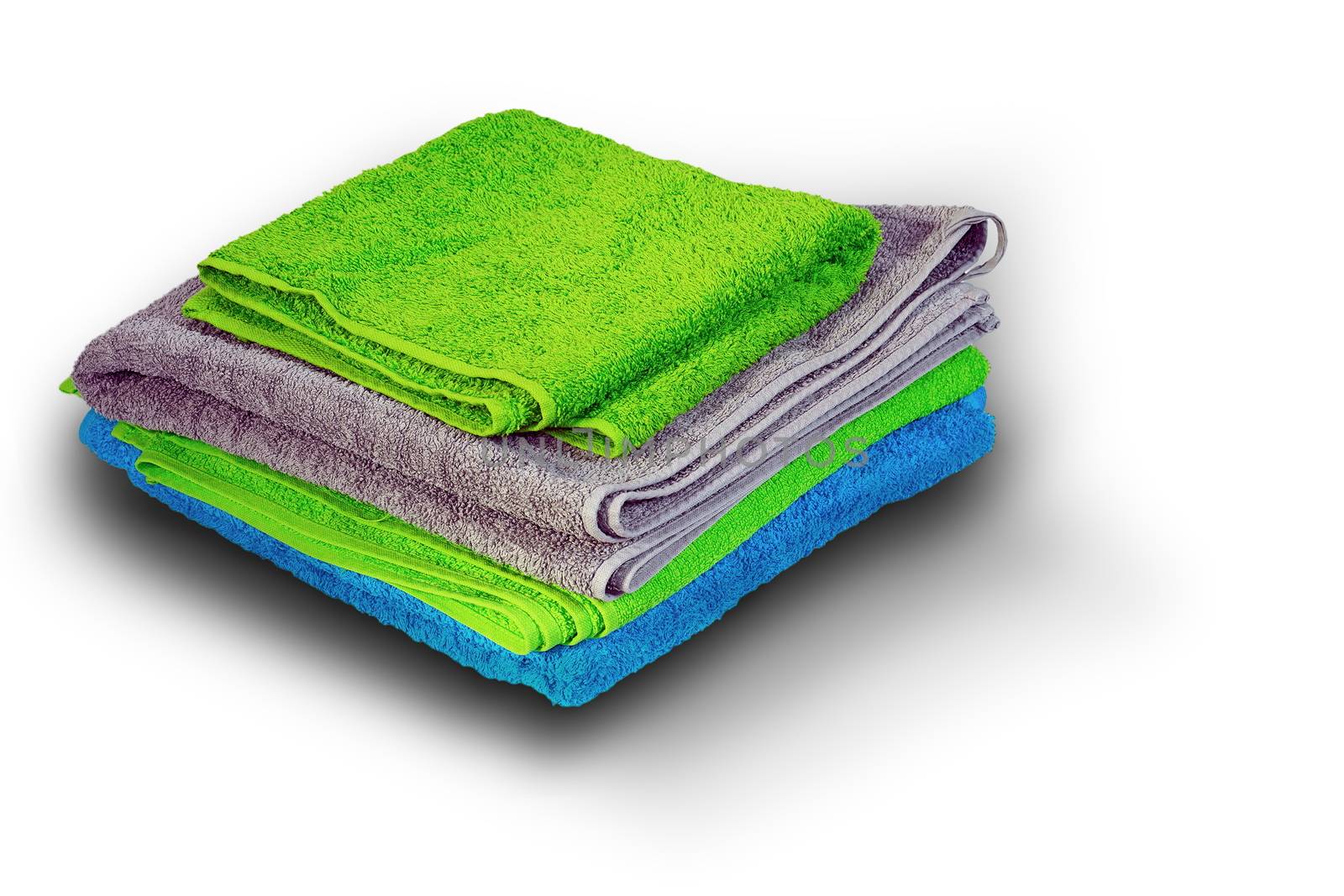 pile of colorful towel on white by taviphoto