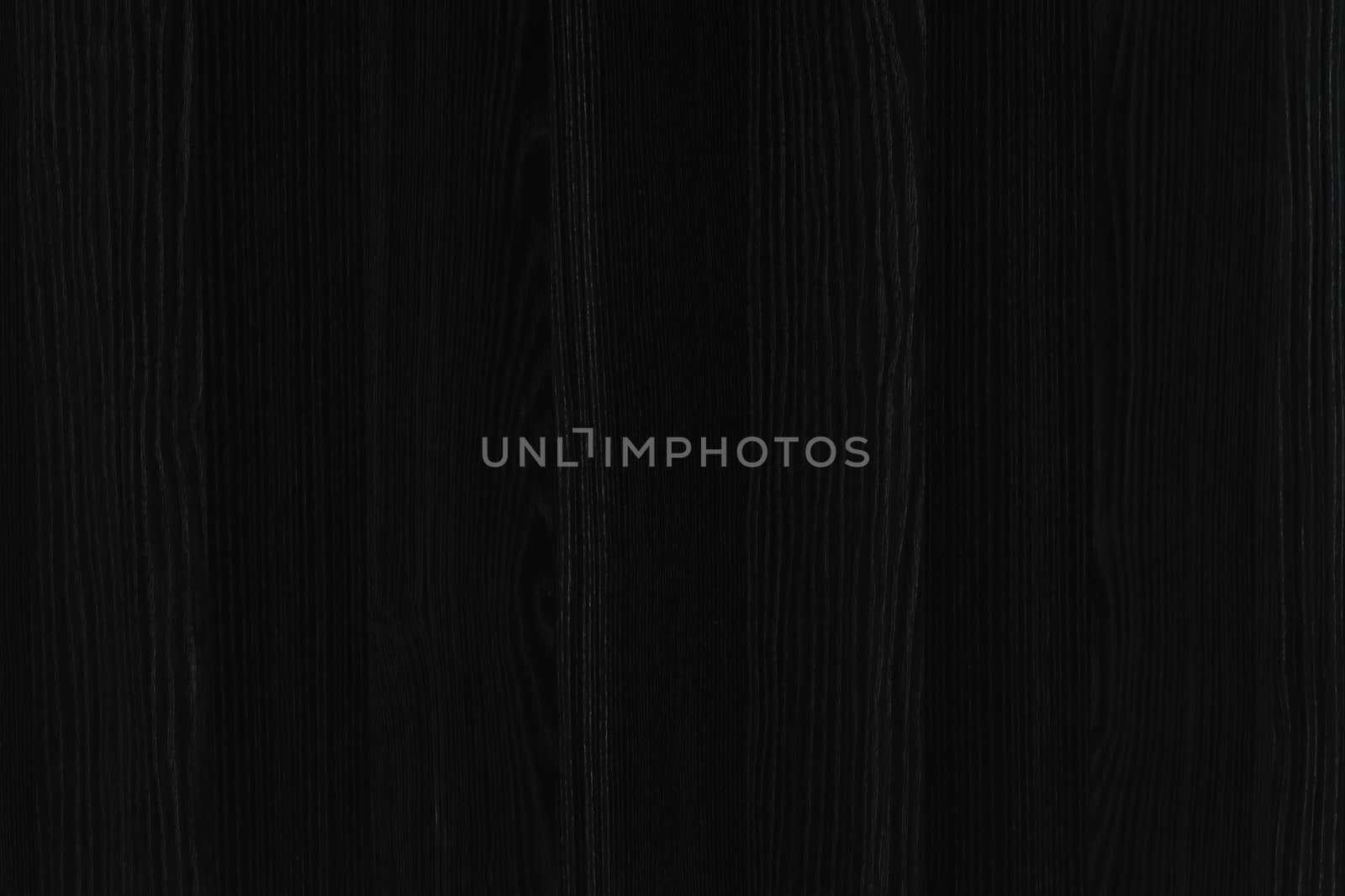 Abstract vignette black wood texture background. Dark furniture plank material wallpaper