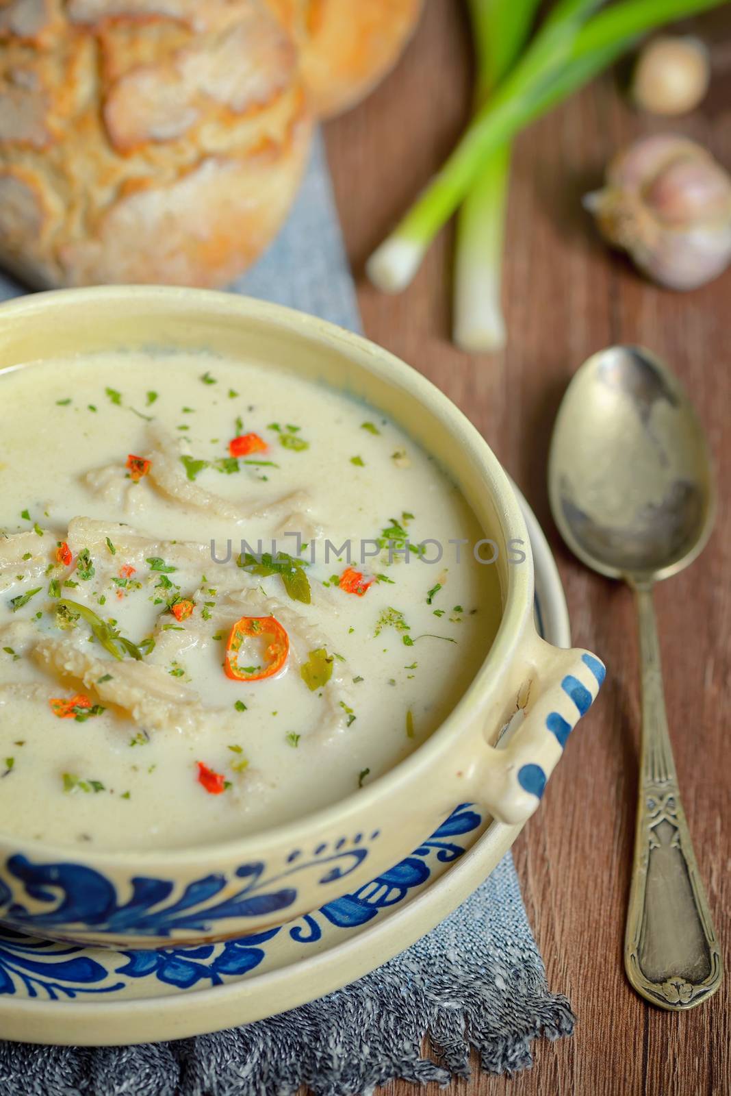 Traditional tripe soup on wooden table