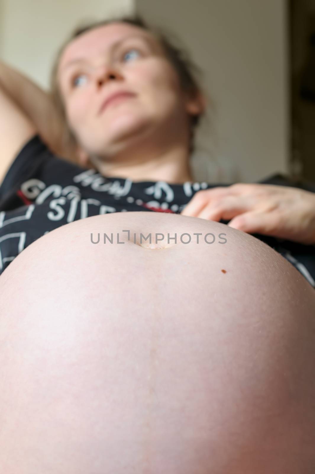 Belly of pregnant woman, nine month by starush