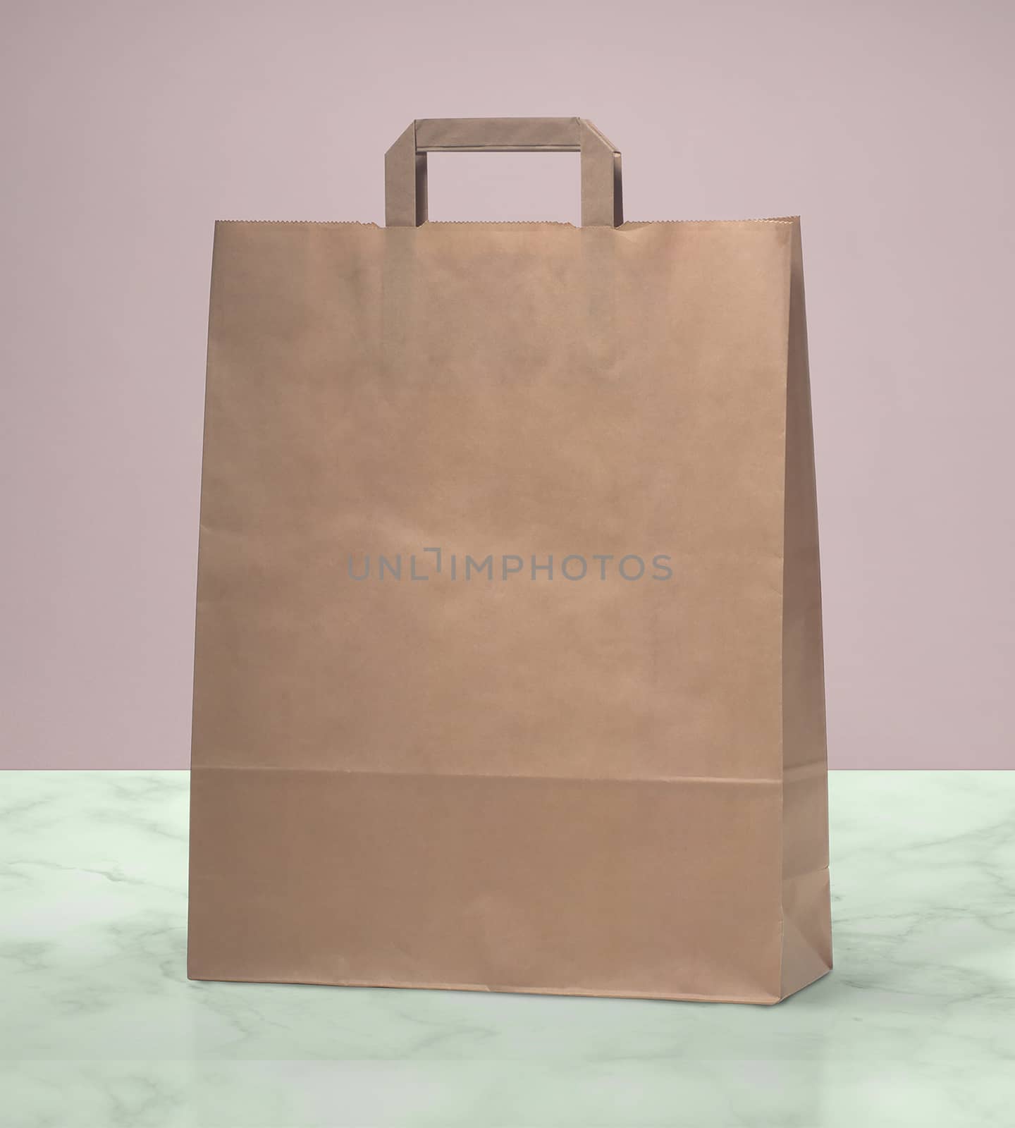 paper bag for shopping on a pink background by boys1983@mail.ru