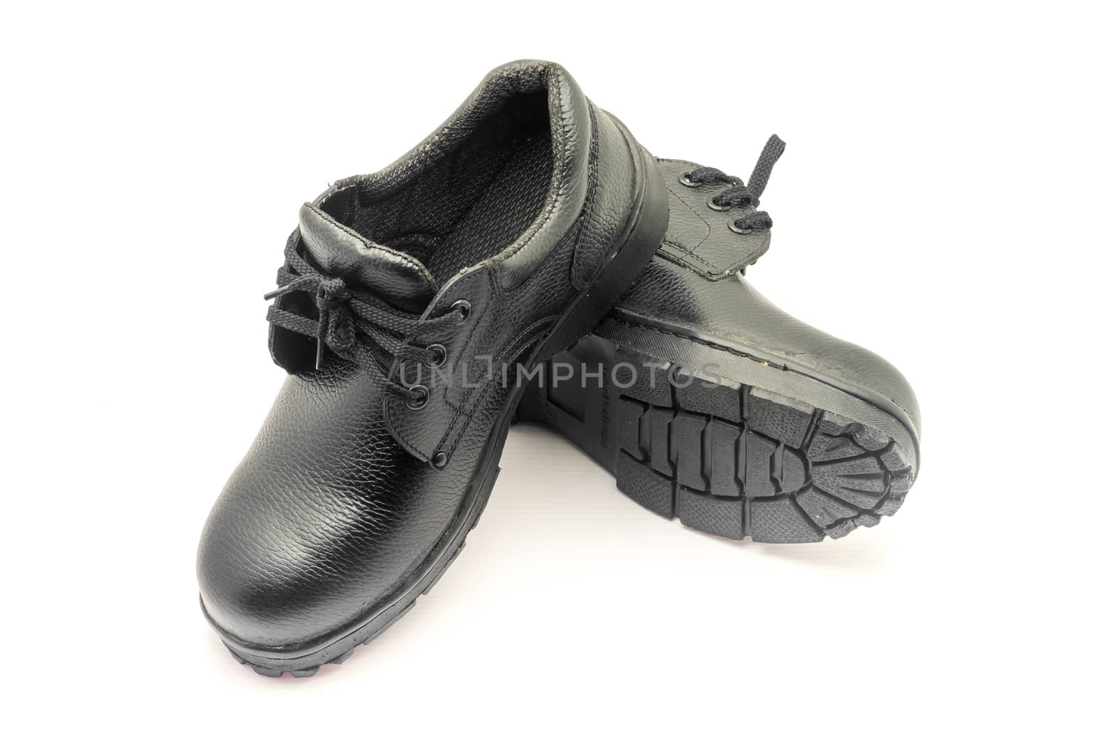 Protective workwear black safety shoes on white background.